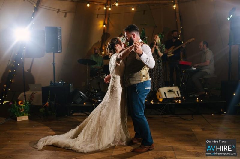 Large speaker package for weddings held in a TiPi - featuring a couple dancing.